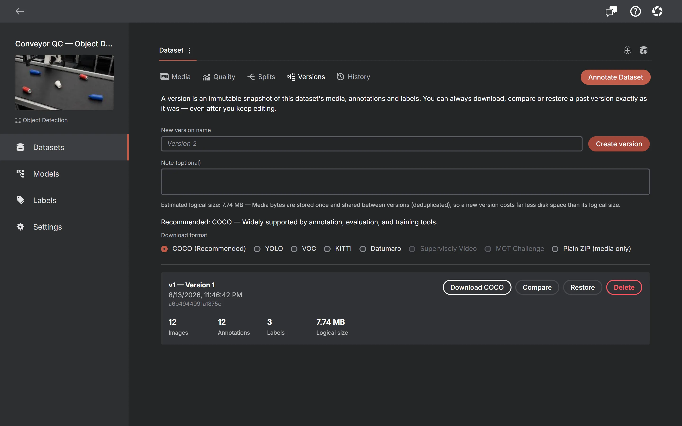 The AnnotateIt Versions tab: a name field and Create version button, a download-format picker, and a saved version card listing image, annotation and label counts with Download, Compare, Restore and Delete actions.