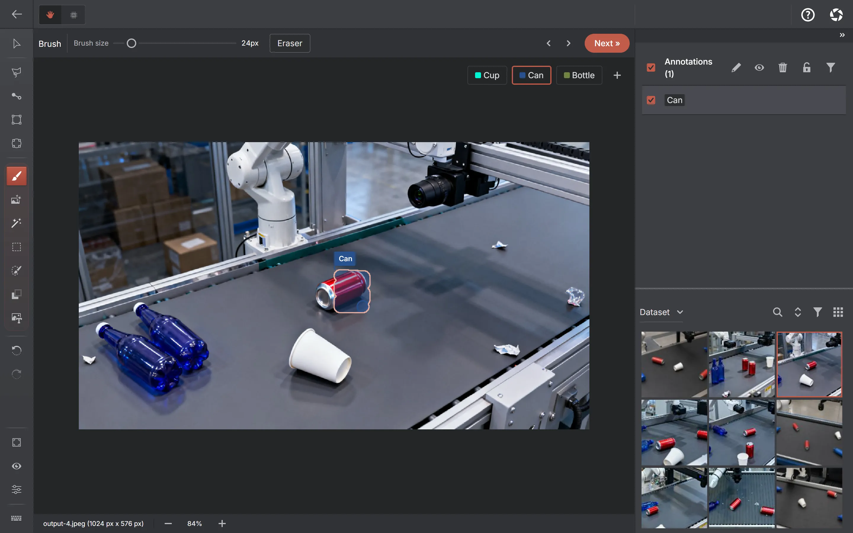 The AnnotateIt annotator with the Brush tool active: a brush-size slider and an Eraser button in the toolbar, and a painted mask covering one object on the conveyor.